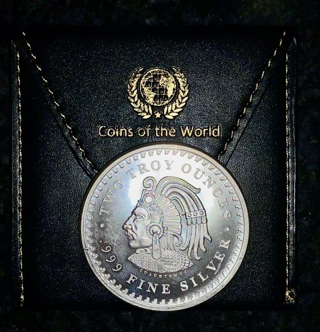 AZTEC 2OZ SILVER ROUND - 2OZ PURE SILVER .999 COMES IN WORLD COIN POUCH
