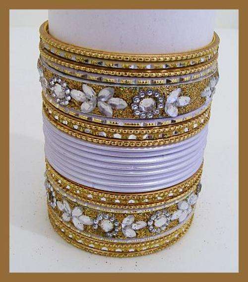 SET OF 22 WHITE AND GOLD BANGLES