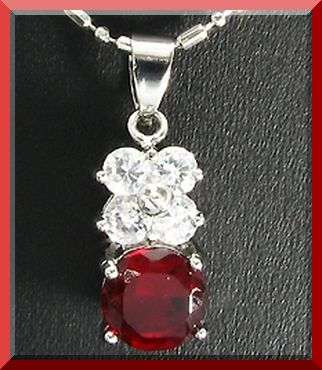 CZ FLOWER AND RUBY PENDANT & CHAIN