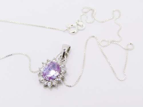 An Elegant Lilac Zirconia Pendant on Chain in Sterling Silver.