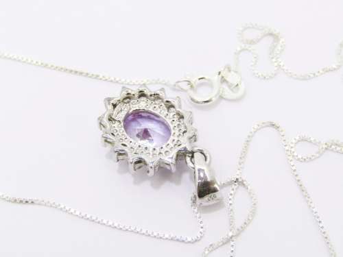 An Elegant Lilac Zirconia Pendant on Chain in Sterling Silver.