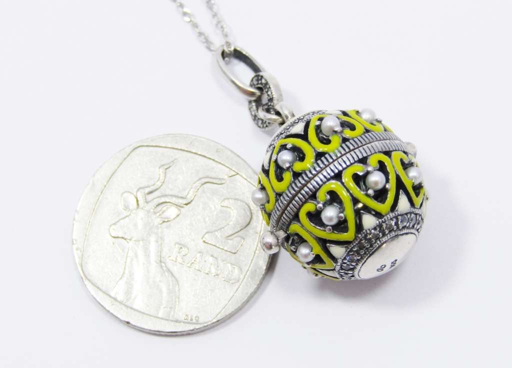 An Amazing  Ornate Ball Locket Surrounded With Enamel Heart Inlay and tiny Seed Pearls on Chain in