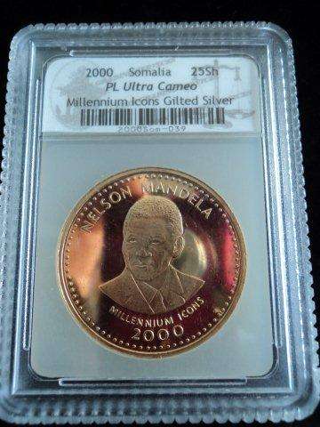 PL ULTRA CAMEO SACGS GRADED - 25 SHILLINGS GILTED SOMALIA MILLENNIUM ICONS NELSON MANDELA.