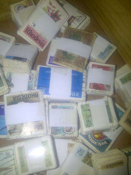THOUSANDS OF STAMPS - RHODESIA, SOUTHERN RHODESIA AND SOME RSA - SEE PHOTO'S!!!!!!