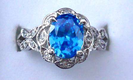 14k SOLID WHITE GOLD BRAZILIAN LONDON BLUE TOPAZ AND WHITE SAPPHIRE RING.