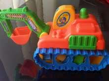 Brightly colour Backhoe with eight shape sorter