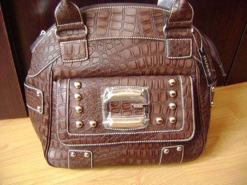 Elegant and stylist GUESS ladies Hand bag in dark brown . A must have luxury