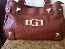 Elegant and stylist GUESS ladies Hand bag in a gorgeous Brown. Faux ostrich leather.