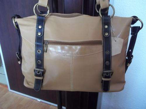 100%  Genuine leather Hand Bag in TAN. Modern and elegant design. Made to last!!