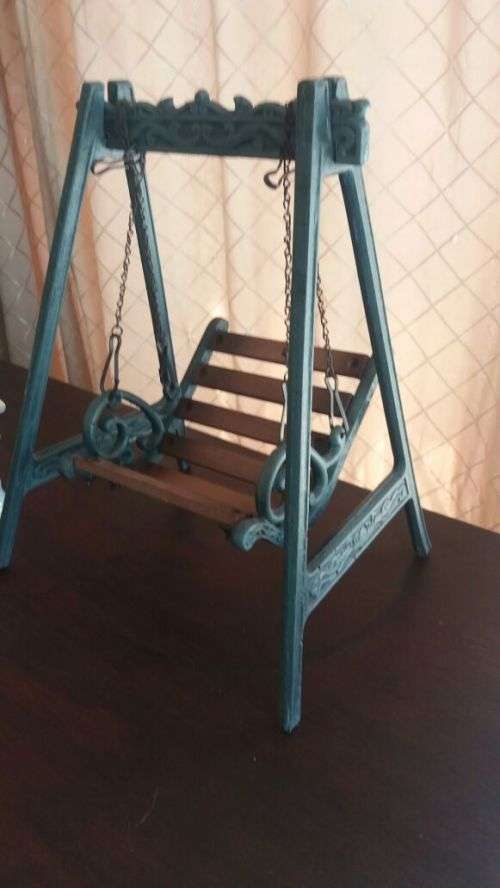 castiron and wooden swing cair