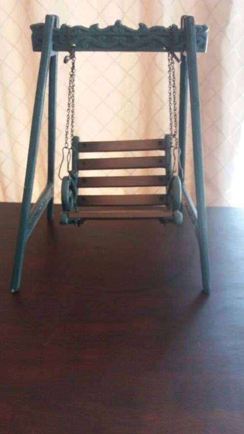 castiron and wooden swing cair
