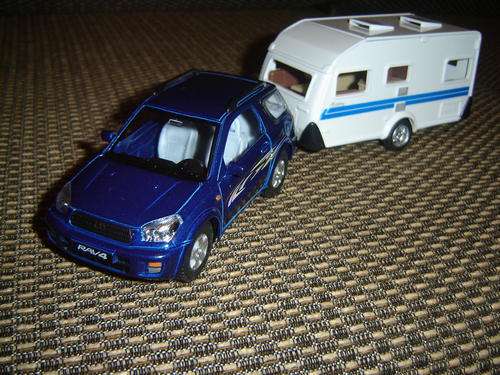 Kinsmart Rav4 Metalic Blue with very Special Caravan that Opens.New in Packaging