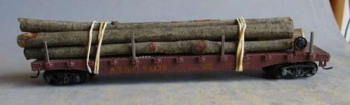 LIMA HO SCALE - STAKE WAGON WITH WOOD LOAD, KD COUPLERS