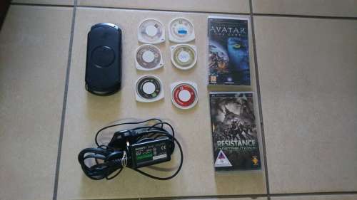 LATE ENTRY - SONY PSP WITH ORGINAL CHARGER AND 8 GAMES