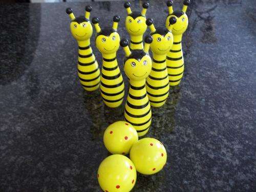 Beautiful Brightly colored wooden bowling ball set. Great fun and amusement.