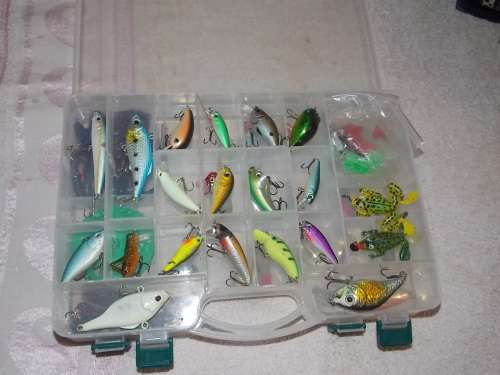 Multi compartment double Fishing lure box with various lures included.