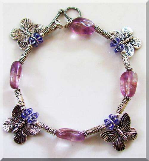 BEAUTIFUL!!! STRIKING CHARM BRACELET WITH AMETHYST AND TIBETAN SILVER