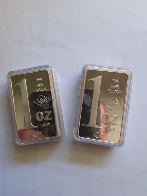 Two 1 troy ounce 999 fine silver marked SBR bullion bars.
