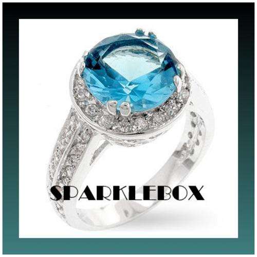 **SILVER TONE AQUAMARINE CZ BAND RING**SIZE 8