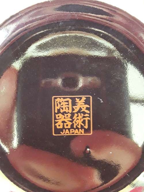 A beautiful decorative ginger jar and candlestick holder set