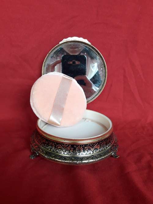 A petit point embroidered powder box