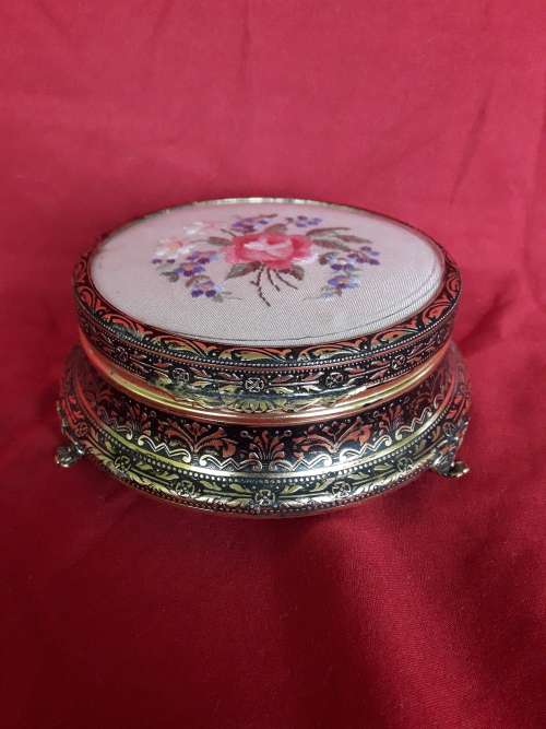 A petit point embroidered powder box