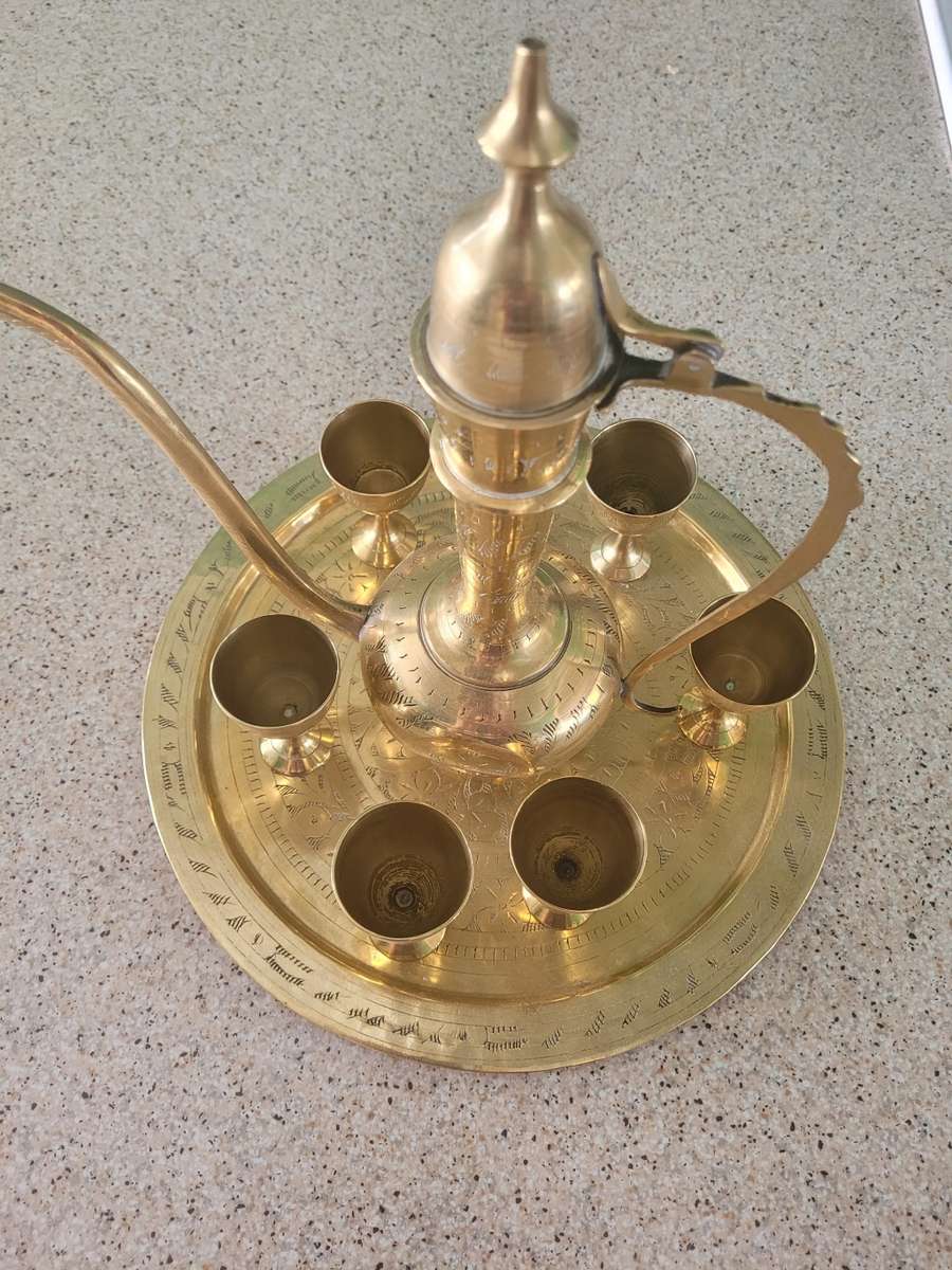 Miniature arty solid brass decanter and six small goblets. on its own tray Very beautifully crafted