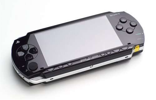 PSP+APPROX 4 GAMES INCLUDING GRAN TURISMO, TW10, GRAN PRIX ETC.