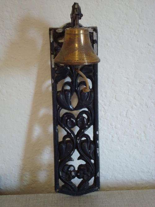 BRASS BELL ON METAL FRAME