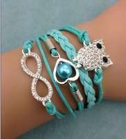 **discounted shipping***Infinity glitter blue owl  Bracelet