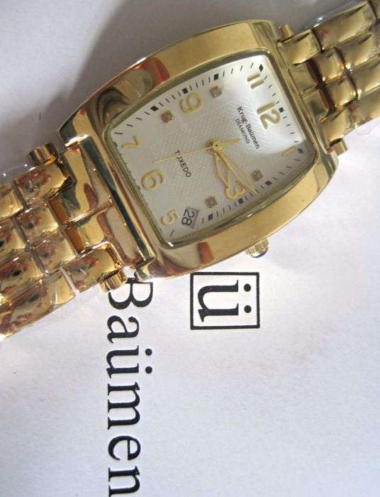 RETAIL: R11,220.21 Krug Baümen MEN Tuxedo 4 Natural Diamond White Dial 18Kt Gold Strap Watch