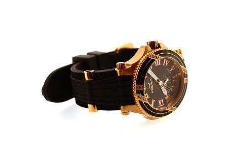 Retail: $1495 /R18,000.00 Aquaswiss Women Bolt L with 22 Diamonds 18K Gold and Black Silicone Band