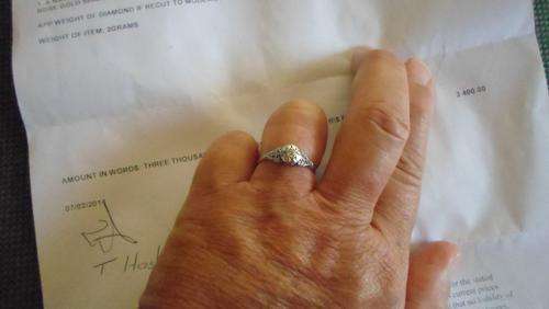 A NATURAL DIAMOND OLD ROSE CUT ,RING SET IN A OLD STYLE PLATINUM TOP RING ON A 9CT ROSE GOLD SHANK