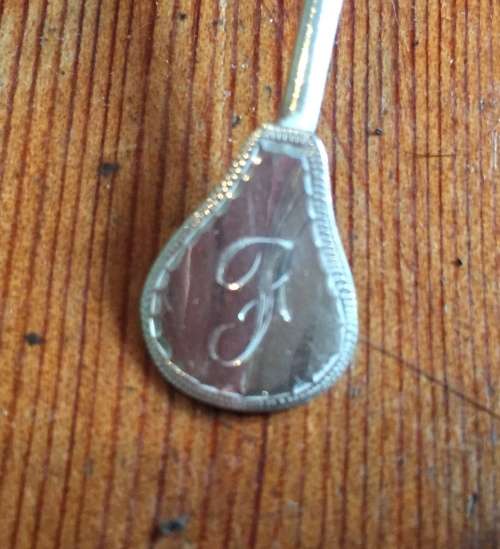 Solid silver decorative napkin rings and spoons