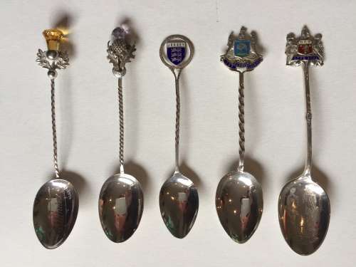 Solid silver decorative napkin rings and spoons