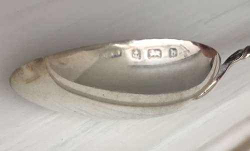 Solid silver decorative napkin rings and spoons