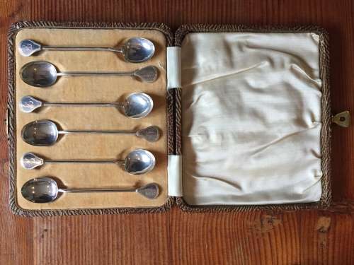 Solid silver decorative napkin rings and spoons