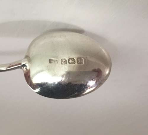 Solid silver decorative napkin rings and spoons