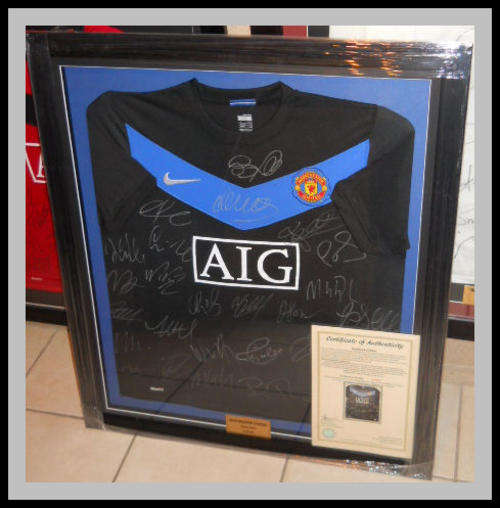FRAMED MANCHESTER UNITED 2009/2010 SQUAD SIGNED AWAY JERSEYS WITH COA