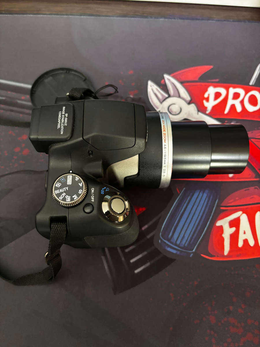 OM SYSTEM OLYMPUS SP-590UZ 12MP Digital Camera with 26X Wide Angle Optical Dual Image Stabilized Zoo