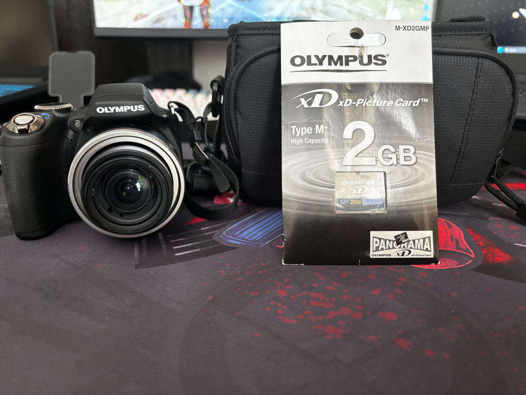 OM SYSTEM OLYMPUS SP-590UZ 12MP Digital Camera with 26X Wide Angle Optical Dual Image Stabilized Zoo