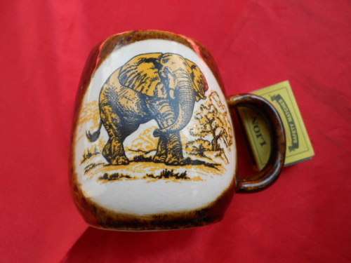Elephant on brown mug.    "A96 Kruger Park" stamp on base.   Very good condition.