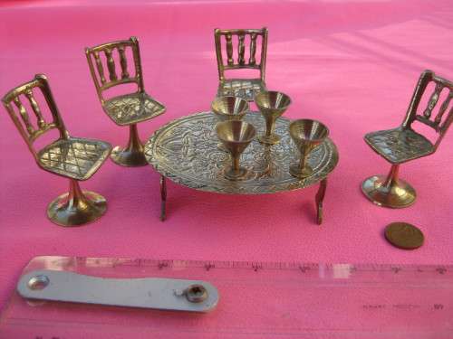 Doll's house/miniature brass table. 4 chairs & 4 goblets.