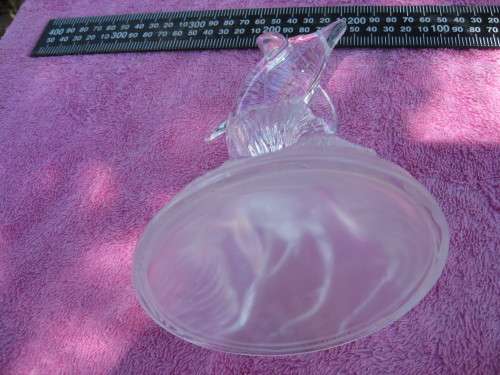 Glass dolphin ornament.