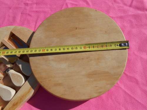 Cheese board with swivel wooden case enclosing knives.  Ready to place on the dining room table.