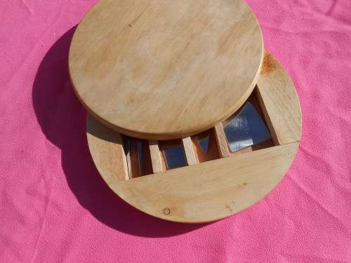 Cheese board with swivel wooden case enclosing knives.  Ready to place on the dining room table.