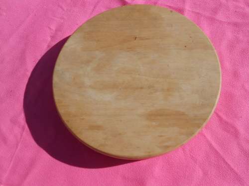 Cheese board with swivel wooden case enclosing knives.  Ready to place on the dining room table.