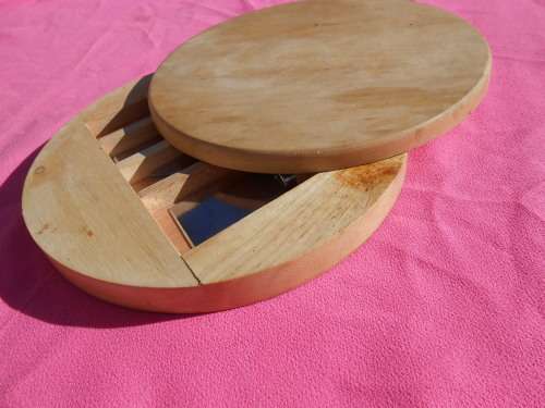 Cheese board with swivel wooden case enclosing knives.  Ready to place on the dining room table.