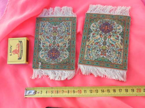 Carpet place-mats or may be suitable as Doll`s-house-sized carpets.