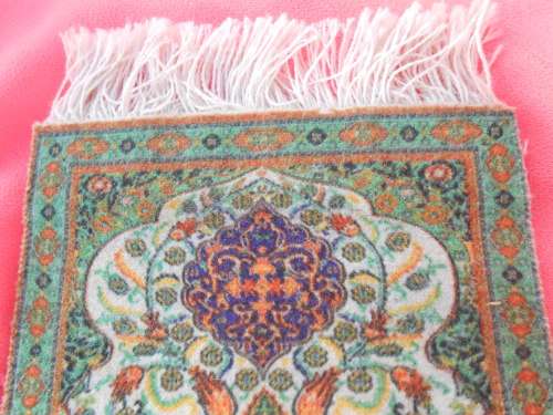 Carpet place-mats or may be suitable as Doll`s-house-sized carpets.